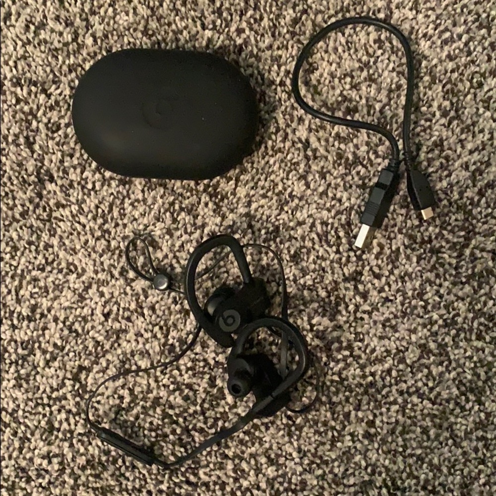 Black wireless Powerbeats series 3 headphones
